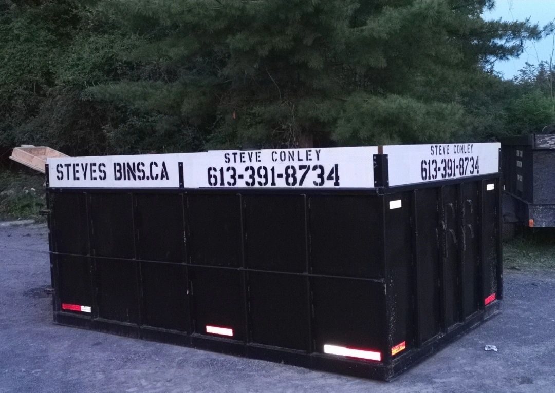 Steve's Bins branded black roll-off disposal bin
