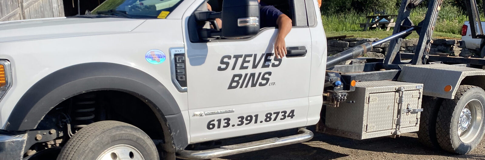 Steve's Bins roll-off truck — we deliver the bin and pick it up when you're done